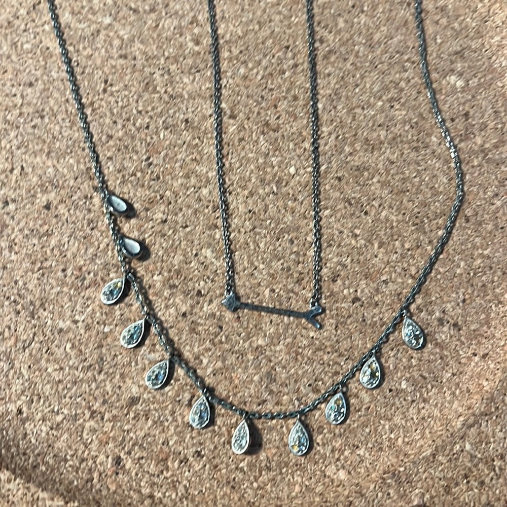 Two delicate silver necklaces. Arrow. Small dangles teardrops sparkles 2sides